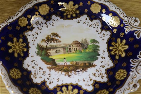 A Staffordshire dessert service, decorated in cobalt blue and gilt and painted topographical scenes